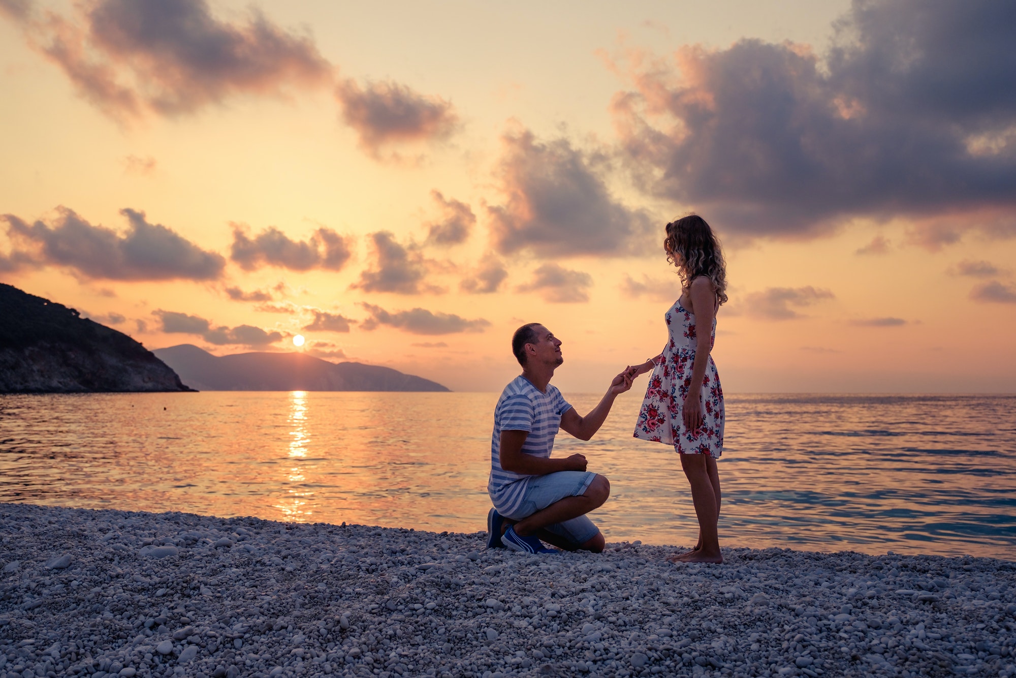 Romantic marriage proposal on the beach